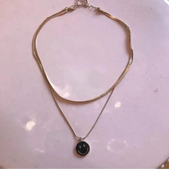 Womens gold plated herringbone style two layer smiley face necklace with charm